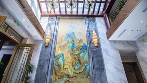 A large mural of a mountainous landscape in a hotel lobby. - The Yard Hotel Beijing Nanluogu Alley (Beijing)