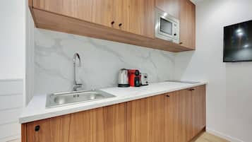 Fridge, microwave, stovetop, coffee/tea maker
