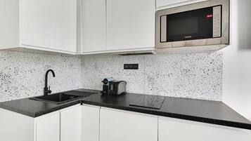 Fridge, microwave, stovetop, coffee/tea maker