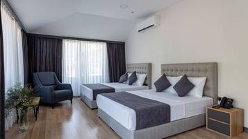 Executive Room | Minibar, in-room safe, desk, laptop workspace