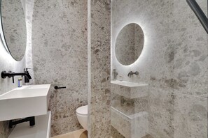 Shower, hair dryer, towels, shampoo