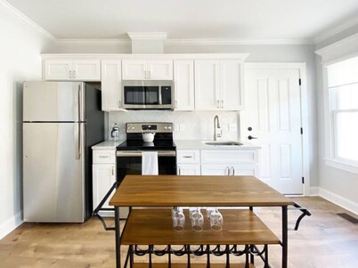 Magnolia Carriage  Shared Courtyard + Garage