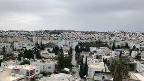 A densely packed urban area with numerous buildings, some with visible satellite dishes and antennas, indicating a residential or mixed-use area. - S+3 new Riadh Andalos Ariana (Ariana)