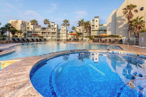 Resort-Style Stay: Beach, Pools & Balcony