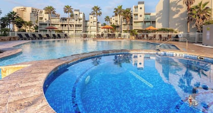 Resort-Style Stay: Beach, Pools & Balcony