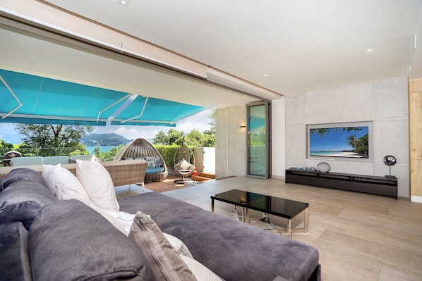 Exclusive Apartment, 3 Bedrooms, Patio, Sea View | Living area | Flat-screen TV