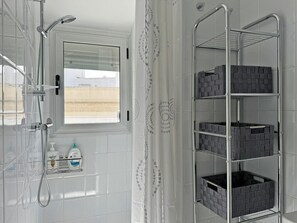 Shower, hair dryer, towels, soap