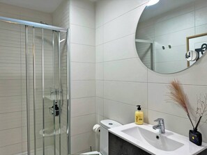 Shower, hair dryer, towels, soap