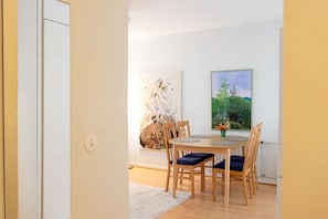 Enjoy meals in this cozy dining area with a round table and comfortable seating for four.
