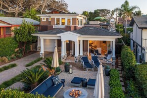 A house with a covered patio, outdoor seating, and a fire pit. - Luxurious Ocean View Coastal Craftman - Walk to Beach (Del Mar)