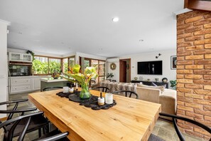 Enjoy meals in this dining area with a table for four, a flat-screen TV, and comfortable seating.