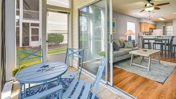 A modern home interior with a dining area, kitchen, and living room. - Myrtle Beach Condo w/ Pool Access: 5 Mi to Ocean (Myrtle Beach)