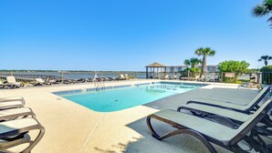 A pool area with lounge chairs and a gazebo. - Private Beach & Pool Access: Murrells Inlet Condo! (Murrells Inlet)