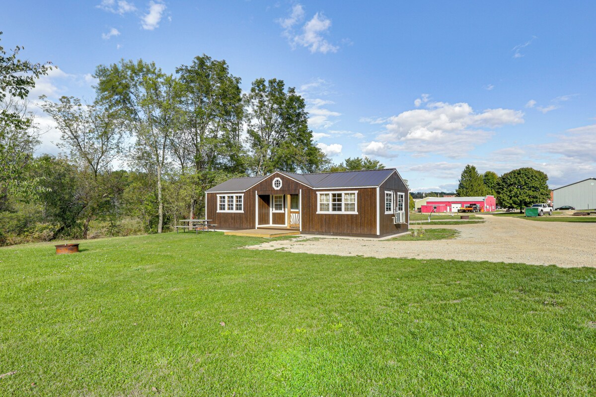 A single-story house with a front porch, a garage, and a well-maintained lawn.