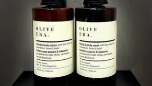 Two bottles of Olive Era hand & body lotion and body wash with bio-diamine.