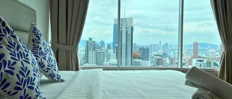 Two Bedrooms Apartment | Desk, blackout drapes, iron/ironing board, free rollaway beds