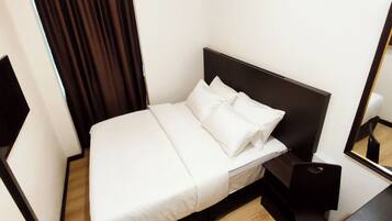 Minibar, desk, blackout curtains, iron/ironing board