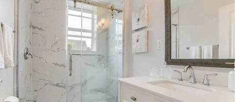 Shower, hair dryer, towels, soap