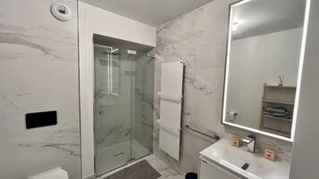 Shower, hair dryer, towels, soap