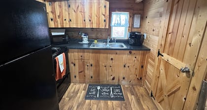 Cozy log cabin located in downtown Moravia, Iowa.