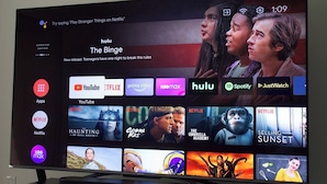 A TV screen displaying a streaming service interface with multiple app icons and movie thumbnails. - Semarang Inn (Semarang)