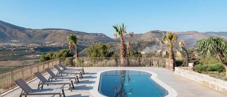 Seasonal outdoor pool, pool umbrellas, sun loungers