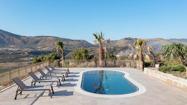 Seasonal outdoor pool, pool umbrellas, pool loungers