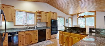 Spacious home with fireplace and two decks with hot tub & bbq grill