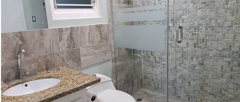 Shower, hair dryer, towels, soap