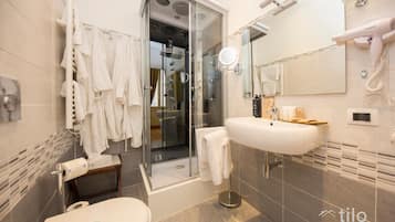 Exclusive Room, City View | Bathroom | Designer toiletries, hair dryer, bathrobes, slippers