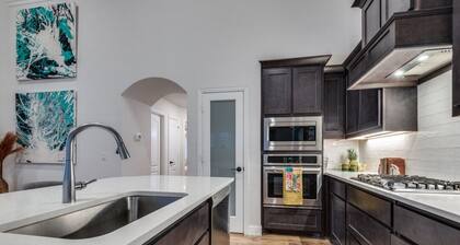 Amazing upgraded masterpiece with a nice gym upstairs, full kitchen, and games!