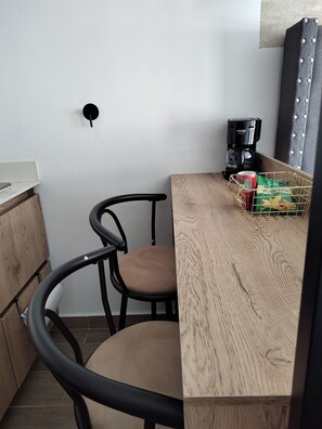 Enjoy a convenient kitchenette with a coffee maker, sink, and storage.
