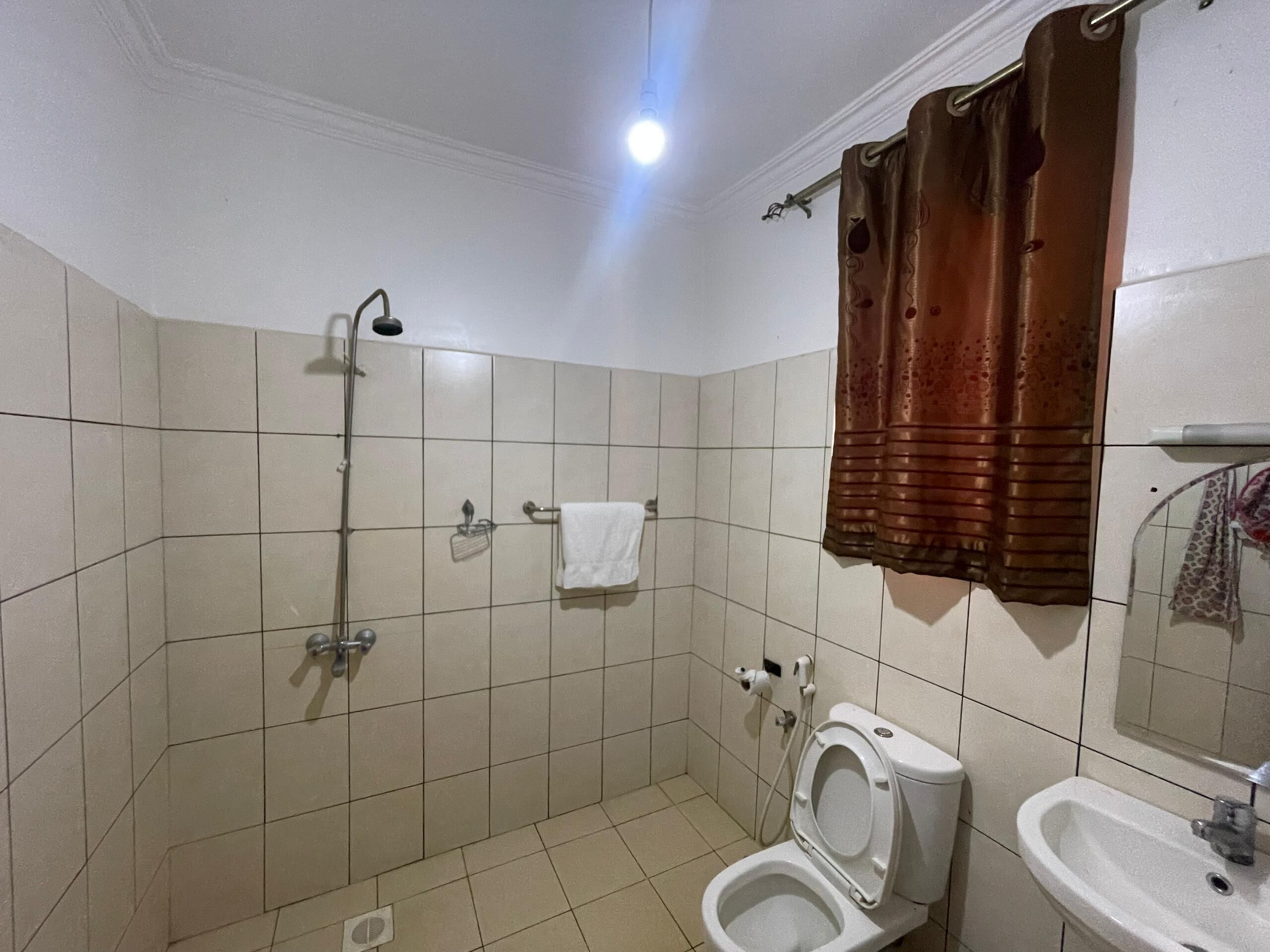 Shower, free toiletries, slippers, towels