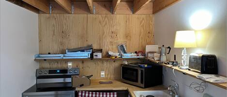 Microwave, stovetop, dining tables