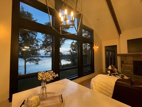New, stunning modern lake home with private swimming beach and dock