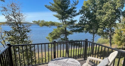 New, stunning modern lake home with private swimming beach and dock