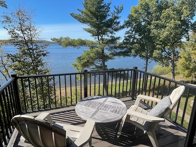 New, stunning modern lake home with private swimming beach and dock