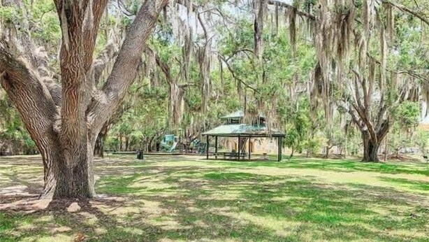 A park with a gazebo and trees.