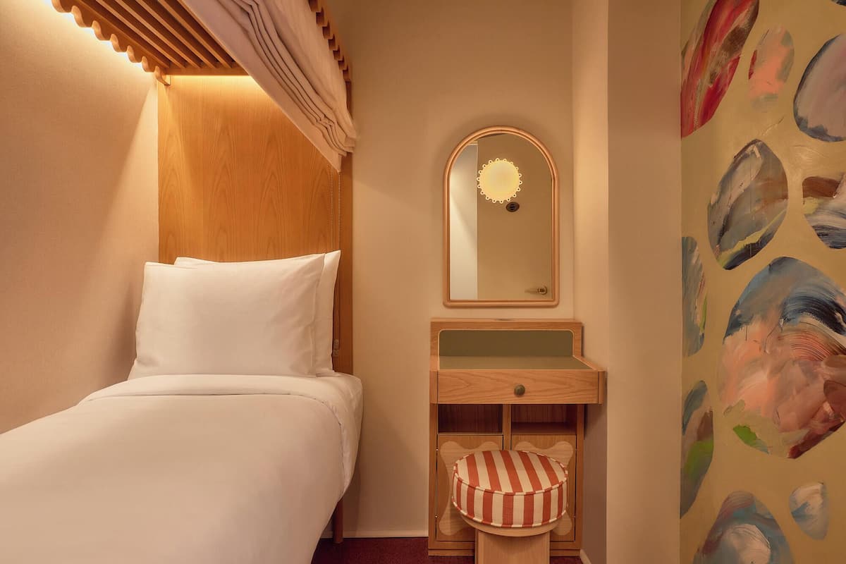 Premium bedding, memory foam beds, desk, laptop workspace