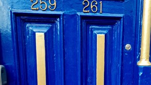 A blue door with two numbers, 259 and 261, indicating apartment numbers. - Stylish studio- 15mins to Central London! (London)