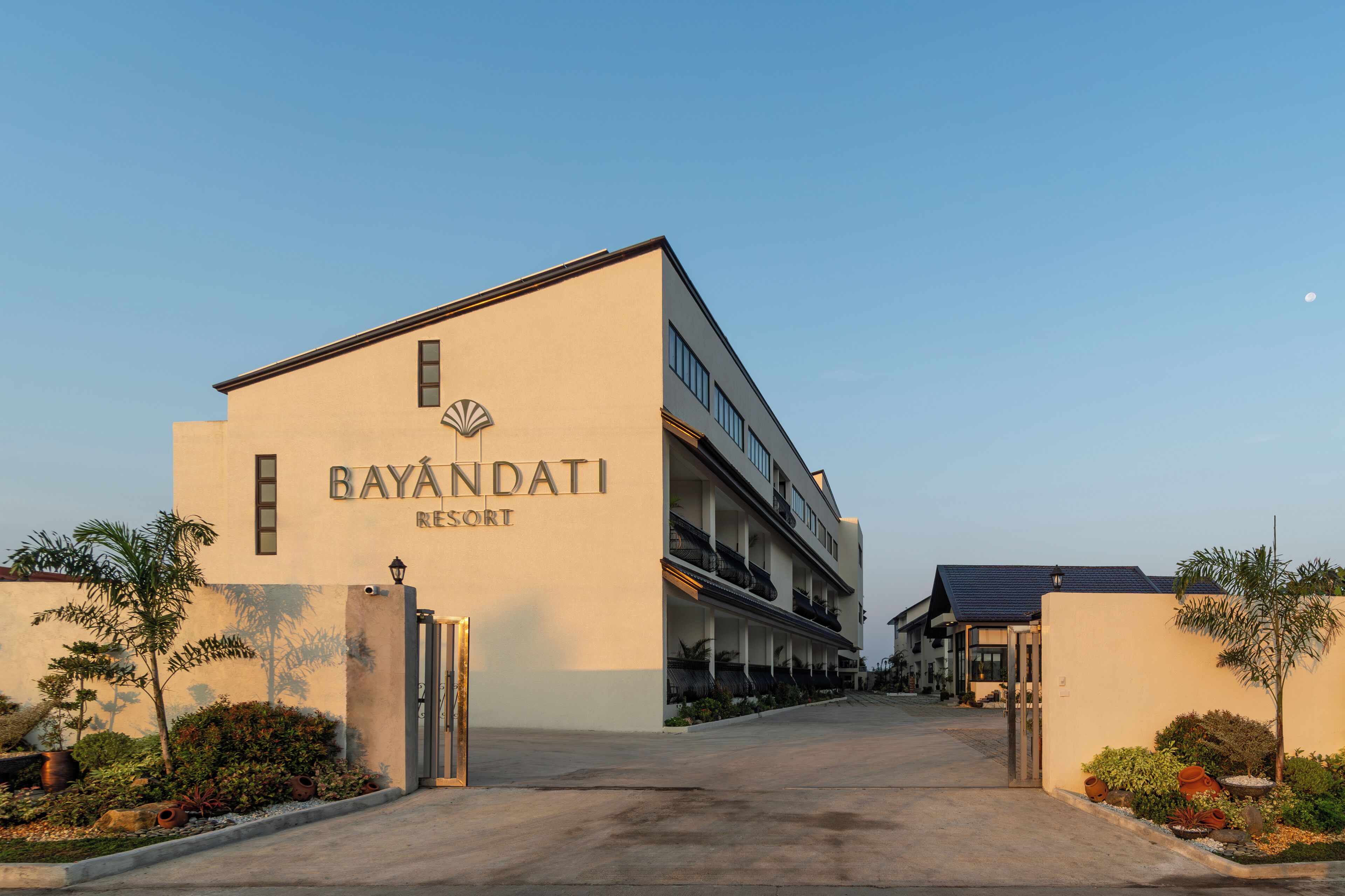 A resort building with a sign reading "BAYANDATI RESORT".