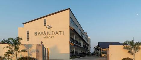 A resort building with a sign reading "BAYANDATI RESORT".