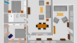 A floor plan of a hotel room with a kitchenette, a dining area, a seating area, and a bathroom.