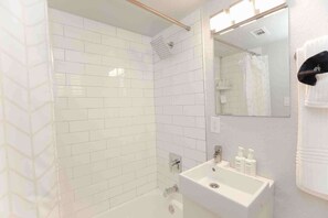 Shower, hair dryer, towels, shampoo