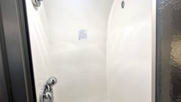 Shower, hair dryer, towels, shampoo