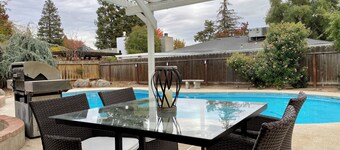 House with a pool next to River Park