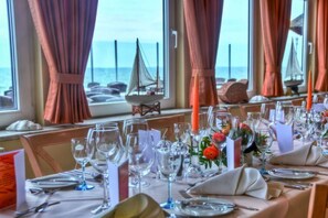 Enjoy a meal with a view from this dining table overlooking the sea.
