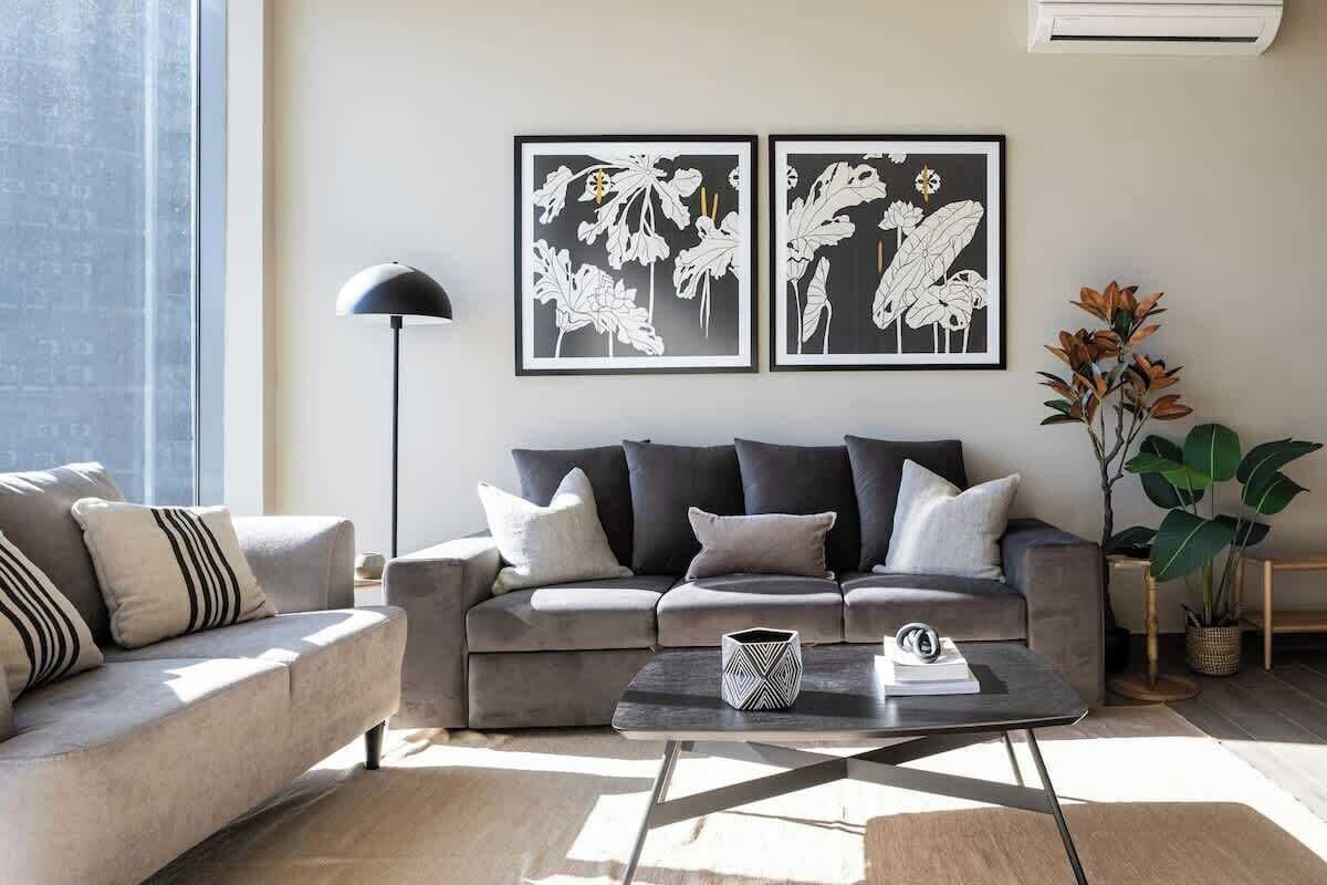 Stylish living room with large windows and mountain views.