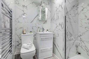 Shower, hair dryer, towels, soap