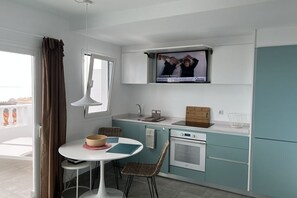 Fridge, oven, stovetop, dining tables